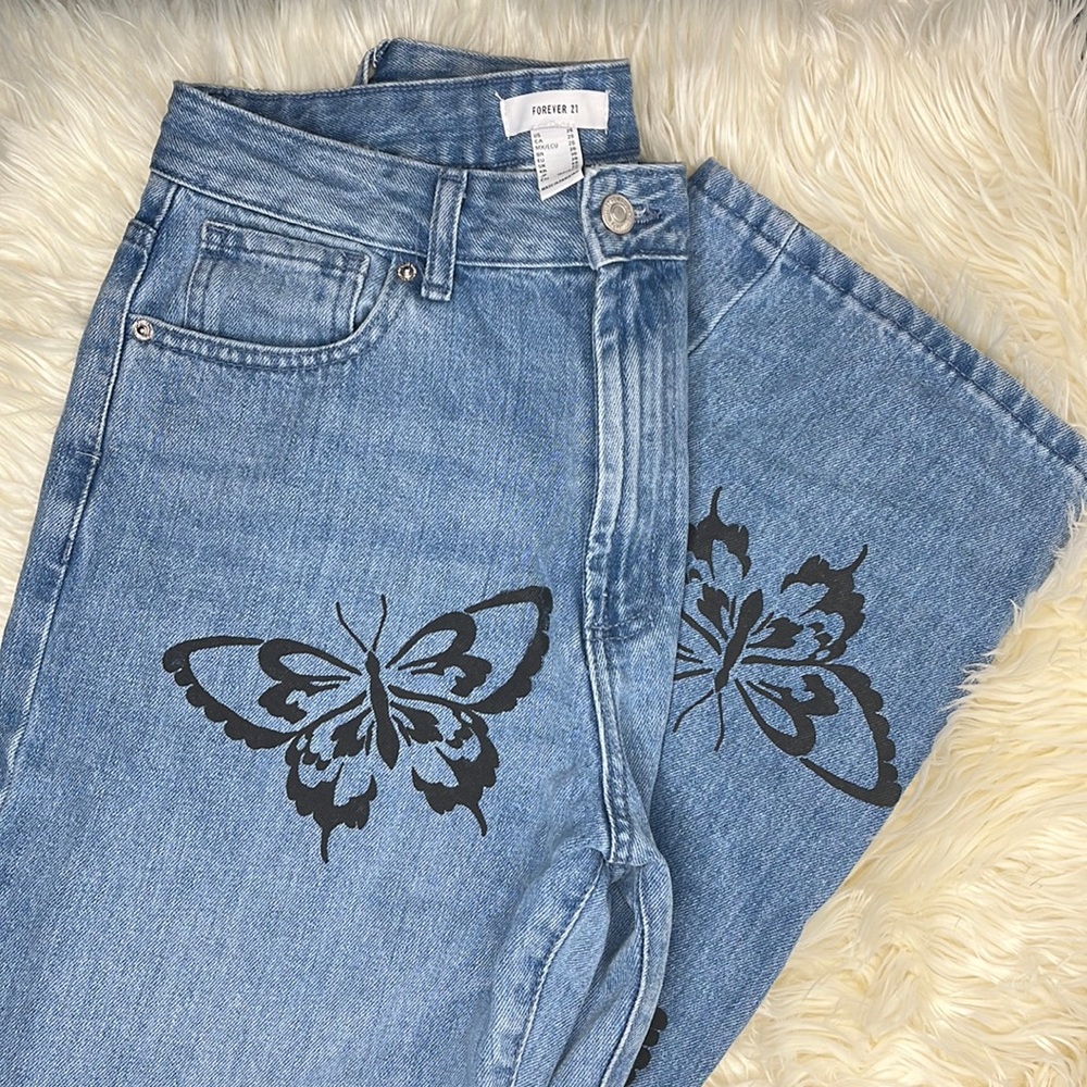 Blue straight legged jeans with Black butterflies all over